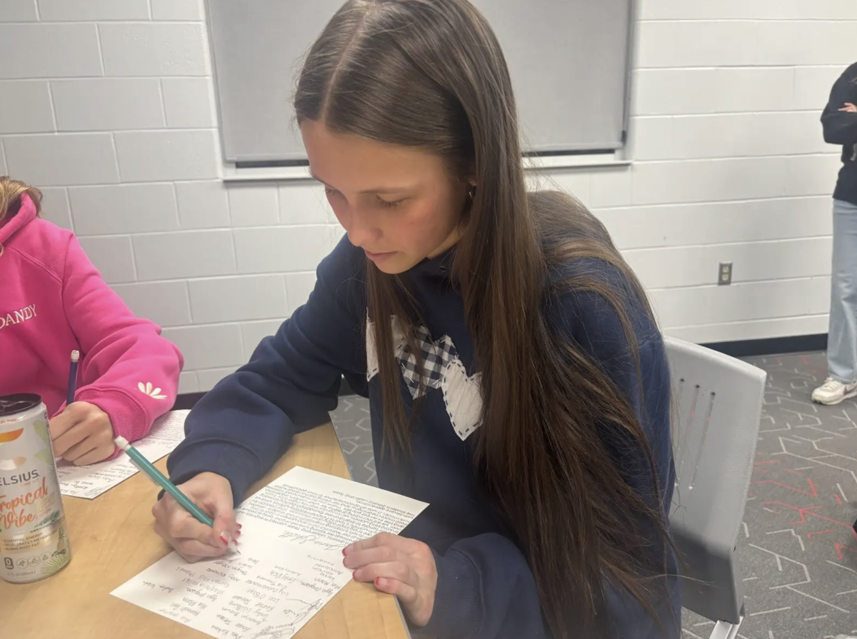 Selia Peters ‘26 signs a thank you card for a guest speaker at National Girls and Women’s in Sports day. The event was held last Wednesday by the S.A.L.T comittee, and celebrated women in athletics on all different levels: high school, collegiate, and pro. “I think it’s important to show our gratitude because their speeches at the event were very powerful and moving for young women in sports like me,” Peters said, “We show our thanks in the form of cards in hopes that they come back and continue to share their advice to young women athletes in the future at CG.”  